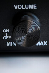 Black volume control and power on and off.