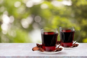 Cold tasty tea in cups on the desk