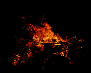 Fototapeta na wymiar Bonfire on beach, burning pallets and drift wood