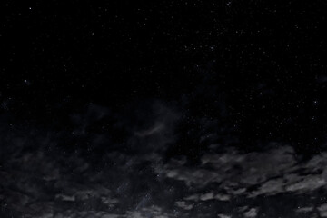 Night Sky above ocean with clouds and amazing stars