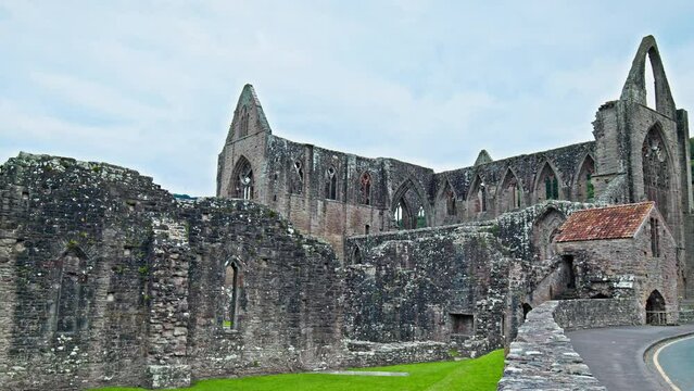 Ruins of the National Icon Monastery of Tintern Abbey in Wales. Ruins of a Cistercian abbey with Gothic West Front and a gift shop  in the village of Tintern in Monmouthshire, Wales
