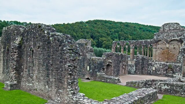 Ruins of the National Icon Monastery of Tintern Abbey in Wales. Ruins of a Cistercian abbey with Gothic West Front and a gift shop  in the village of Tintern in Monmouthshire, Wales
