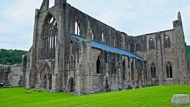 Ruins of the National Icon Monastery of Tintern Abbey in Wales. Ruins of a Cistercian abbey with Gothic West Front and a gift shop  in the village of Tintern in Monmouthshire, Wales
