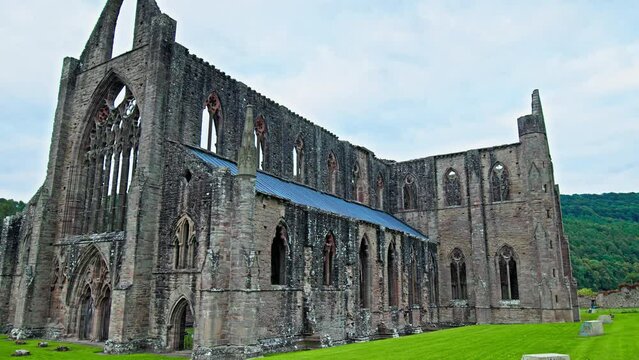 Ruins of the National Icon Monastery of Tintern Abbey in Wales. Ruins of a Cistercian abbey with Gothic West Front and a gift shop  in the village of Tintern in Monmouthshire, Wales

