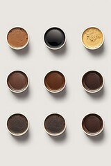A collection of coffee cups arranged on a table. This versatile image can be used to showcase coffee shops, cafes, breakfast scenes, or gatherings with friends and colleagues