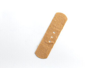 Band-aid on white background. Punctuation mark made with a band-aid, slash.