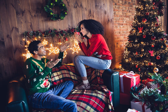 Photo of family lovers friends girl guy sit couch have conversation about christmas spirit drink hot cacao in tradition decor house