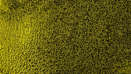 Texture of the metal surface of a wall made of non-ferrous metal.