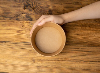 Bowl in Hands, Empty Bowl in Arms on Wooden Background, Vintage Kitchen Tableware Mockup