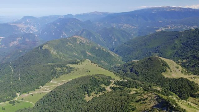 aerial shot above mountains on a summer day at pic de l'Ourtiset Pyrenees region France