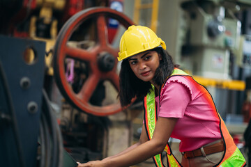 Industrial worker inspecting machine at factory machines. Technician working in the metal sheet company. Foreman checking Material or Machine.