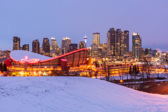 Calgary skyline with Saddledome stadium on a snowy night