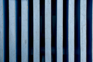 Blue pattern of a wooden bench with curved geometry, vertical slats - obrazy, fototapety, plakaty