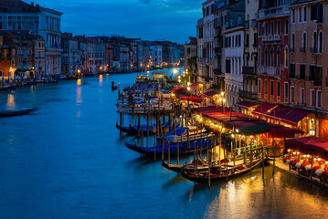 Grand Canal with gondolas in Venice, Italy. Night view of Venice Grand Canal. Architecture and...