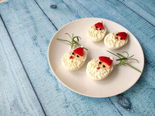 Christmas food art made from eggs, funny Santa eggs, Santa eggs