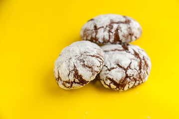 Chocolate brownie cookies closeup on a yellow background.Homemade baking,sweet dessert.