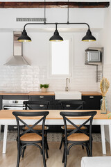 Furnished kitchen area with appliances and furniture