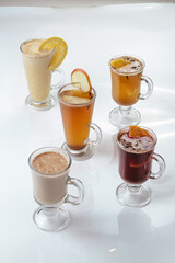 warm winter drinks in glasses on a white background, isolate