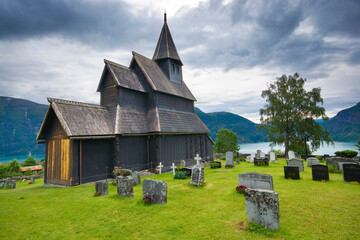Urnes stave church in Ornes, along the Lustrafjorden, Norway - 674882524