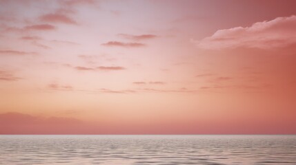 Obraz premium Gradient sky during a soft pink hued sunset over a calm ocean