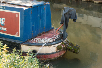 Fototapeta na wymiar A house boat docked on Stort River in Bishop's Stortford in England