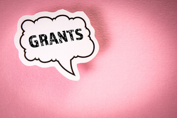 Grants Concept. Speech bubble with text on pink background