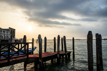 Fototapeta premium Looking out over the lagoon of Venice to a morning sun