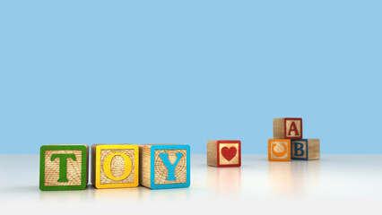 TOY BLOCKS ABC COLORFUL ALPHABET CUBES. Blue background cubes brick wood. ABC learning, education and language concept