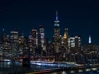 Fototapeta na wymiar New York bridge near me. Aerial night drone photo with city lights and river