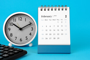 Fototapeta na wymiar February 2024 Desk Calendar on Blue Background