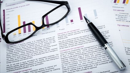 Glasses And Pen On Business Sheets Close-up