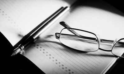 Glasses And Fountain Pen On Notebook Close-up