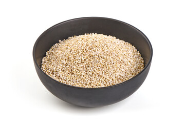 Barley groats in bowl, isolated on white background.