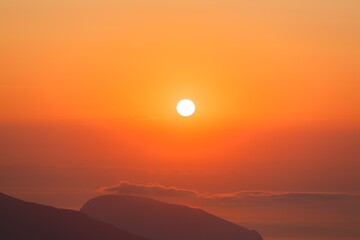 Beautiful mountain landscape with sunset sky with sea