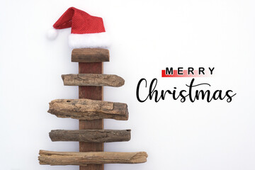 Minimalism style rustic Christmas tree on white background with merry Christmas greeting for...