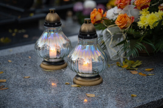 Lanterns and flowers on the grave on All Saints' Day