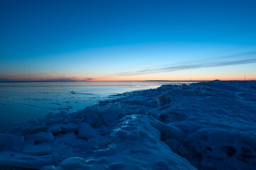 The frozen shores of Gulf of Bothnia in winter in Finland with packed ice in the foreground © Jani Katajisto