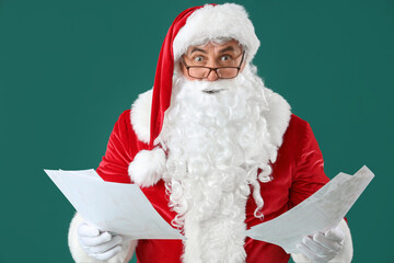Shocked Santa Claus with letters on green background