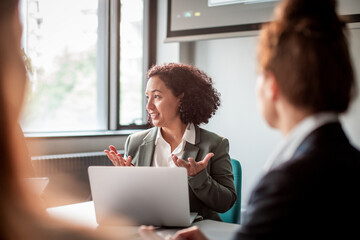Businesswoman giving presentation in conference room