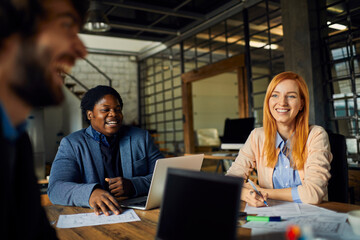 Young business partners having meeting in office