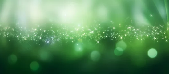 Poster green Sparkling Lights Festive background with texture. Abstract Christmas twinkled bright bokeh defocused © RMedia