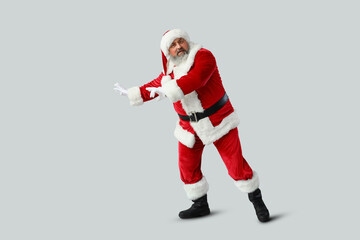 Dancing Santa Claus on grey background