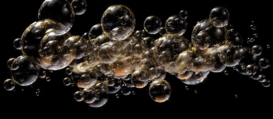 Rainbow soap bubbles on black background. - obrazy, fototapety, plakaty