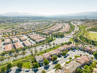 Valencia, California - October 24, 2023: aerial drone photo view toward  West Creek Townhouse in Valencia with new townhouse homes and West Creek Park