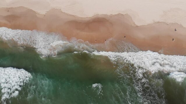 wave hitting the beach sunshine coast