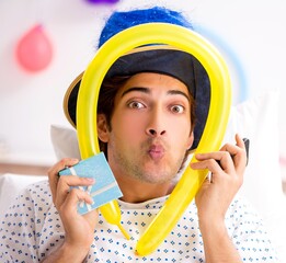 Young man celebrating his birthday in hospital