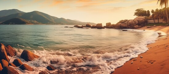 Obraz premium The beautiful beach with a stunning background of the clear blue sky and sparkling water is the perfect travel destination for those seeking to connect with nature and admire the breathtakin