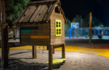 Children playground in city park at night.