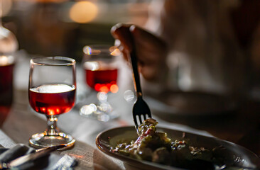 Woman eating salad in a restaurant.