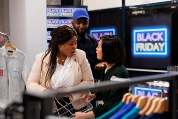 Foto op Canvas African American man security guard dealing with crazy aggressive shoppers, patrolling clothing store during Black Friday sales. Two diverse shopaholic woman bargain hunters arguing during shopping © DC Studio